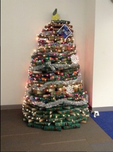 Tall green Chritsmas tree constructed from books.
